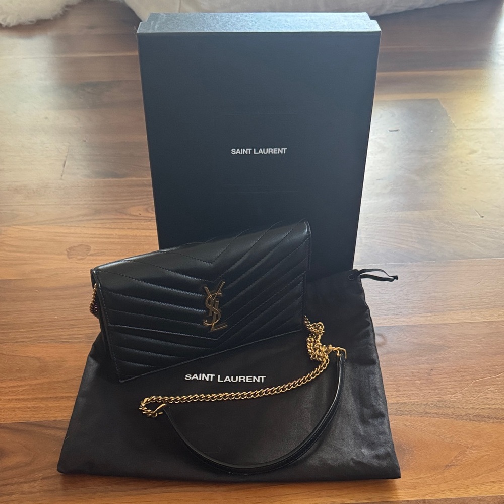 Saint Laurent Black Quilted Clutch with Gold Chain. Box, dust bag included.